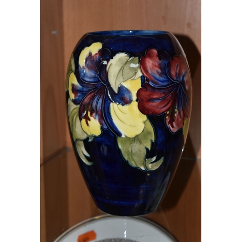 372 - A MOORCROFT POTTERY 'HIBISCUS' PATTERN VASE, of ovoid form, tube lined with red, purple and yellow h... 