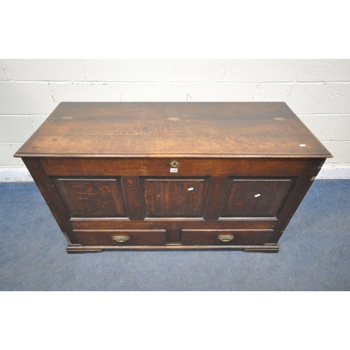 1279 - A GEORGIAN OAK COFFER, with a hinged lid, three front panels, and two drawers, width 136cm x depth 5... 