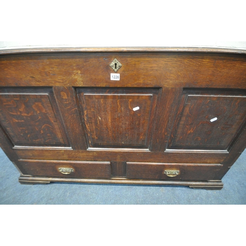 1279 - A GEORGIAN OAK COFFER, with a hinged lid, three front panels, and two drawers, width 136cm x depth 5... 