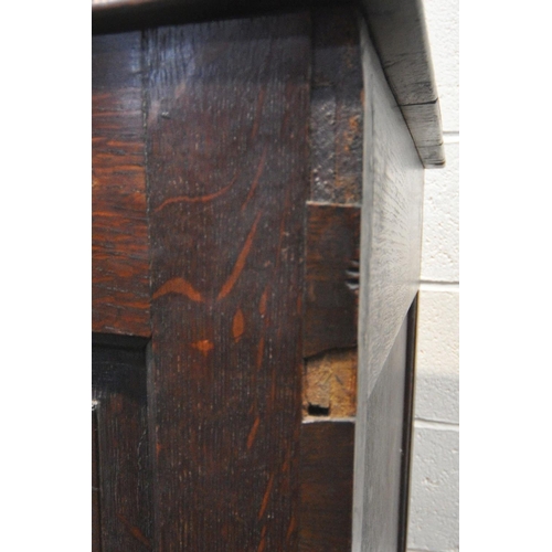 1279 - A GEORGIAN OAK COFFER, with a hinged lid, three front panels, and two drawers, width 136cm x depth 5... 