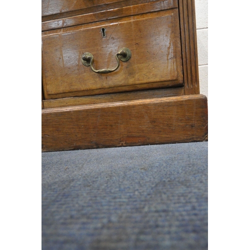 1203 - A 20TH CENTURY OAK TWIN PEDESTAL DESK, with green inlaid writing surface, fitted with nine assorted ... 