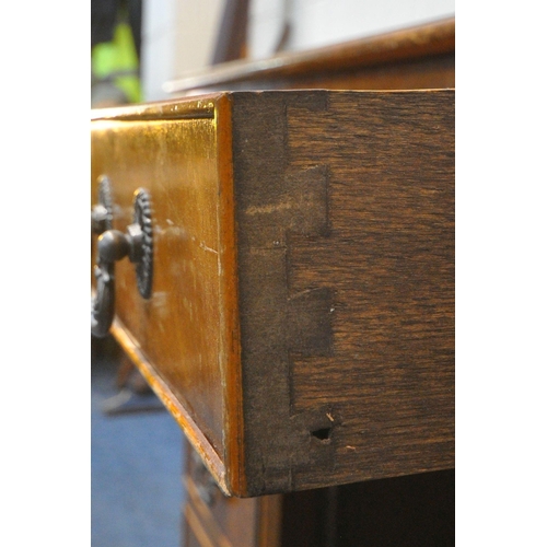 1204 - A 20TH CENTURY MAHOGANY TWIN PEDESTAL DINING TABLE, with a burgundy leather writing surface, fitted ... 