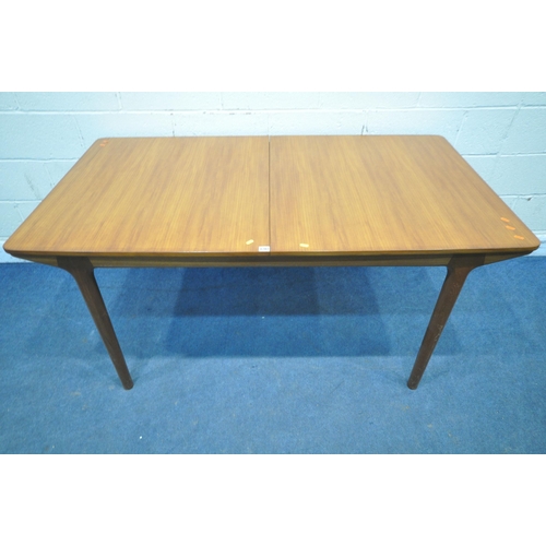 1207 - A.H. McINTOSH & CO LTD, KIRKCALDY, SCOTLAND, A MID CENTURY TEAK EXTENDING DINING TABLE, with two fol... 