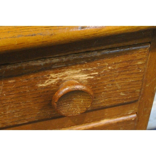 1211 - LUCIAN ERCOLANI, A MID CENTURY ELM AND BEECH SIDEBOARD, fitted with four assorted drawers, and four ... 