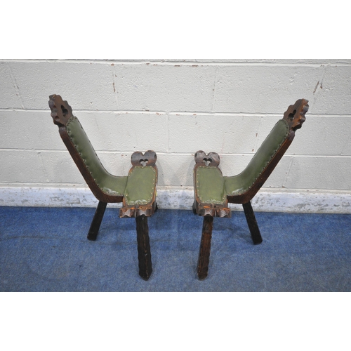 1212 - A PAIR OF 20TH CENTURY OAK BIRTHING STOOLS, with trefoil design, green leather upholstery, raised on... 