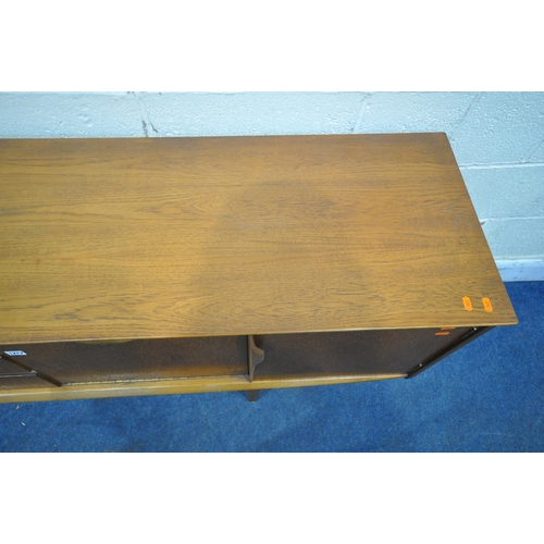 1217 - POSSIBLY JENTIQUE, A MID CENTURY TEAK SIDEBOARD, fitted with three drawers, two cupboard doors and a... 