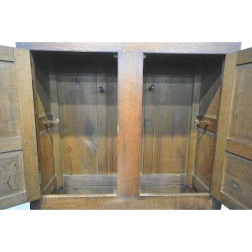 1222 - A GEORGIAN OAK WELSH CUPBOARD, fitted with double cupboard doors, atop a base with three dummy drawe... 