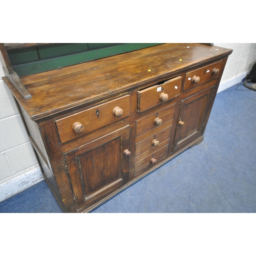 1223 - A VICTORIAN PINE DRESSER, the three tier plate rack, atop a base that's fitted with three drawers, t... 