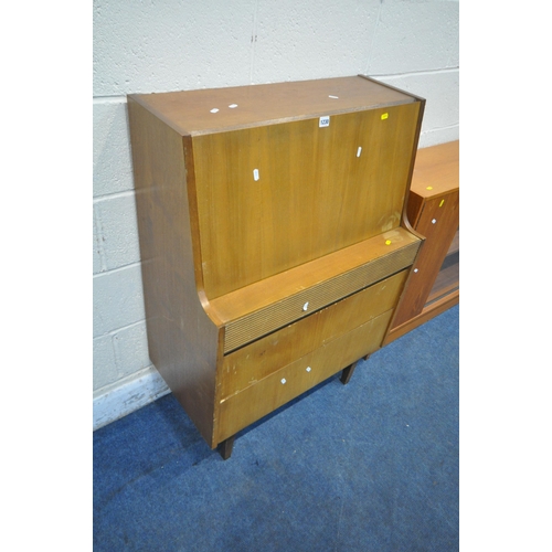 1230 - ELLIOTTS OF NEWBURY, A MID CENTURY TEAK BUREAU, the fall front door enclosing a fitted interior, abo... 