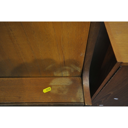 1230 - ELLIOTTS OF NEWBURY, A MID CENTURY TEAK BUREAU, the fall front door enclosing a fitted interior, abo... 