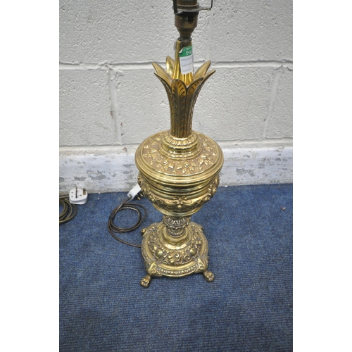 1235 - A PAIR OF BULBOUS BRASS TABLE LAMPS, with intricate details, raised on four paw feet, height to fitt... 