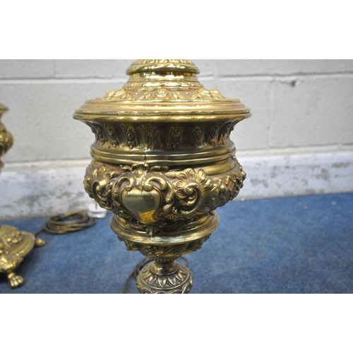 1235 - A PAIR OF BULBOUS BRASS TABLE LAMPS, with intricate details, raised on four paw feet, height to fitt... 