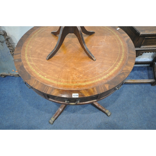 1239 - A MAHOGANY CIRCULAR DRUM TABLE, with leather inlay, four drawers, raised on a turned support and fou... 