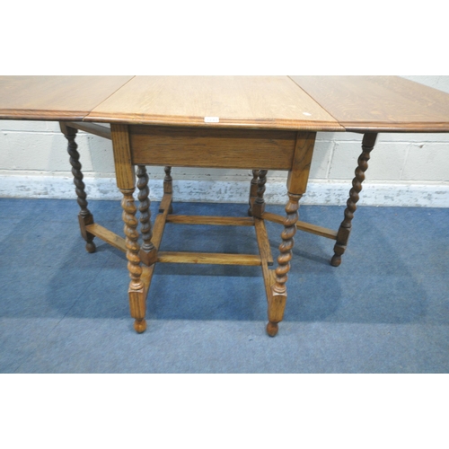 1241 - A 20TH CENTURY OAK BARLEY TWIST GATE LEG TABLE, open width 149cm x closed width 61cm x depth 107cm x... 