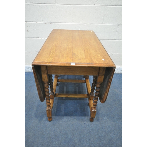 1241 - A 20TH CENTURY OAK BARLEY TWIST GATE LEG TABLE, open width 149cm x closed width 61cm x depth 107cm x... 