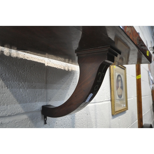 1242 - A 19TH CENTURY WALNUT CANTERBURY, with a concave front, turned spindles, a single drawer, raised on ... 