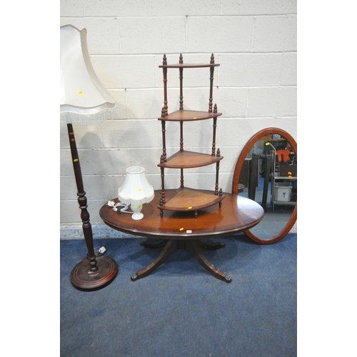 1269 - A MAHOGANY OVAL COFFEE TABLE, a four tier corner what-not, an oval mirror, a standard lamp and a tab... 