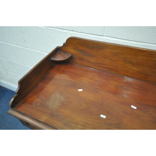 1275 - A VICTORIAN MAHOGANY WASHSTAND, with raised back and sides, fitted with two short over two long draw... 