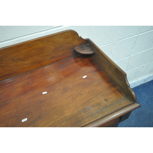 1275 - A VICTORIAN MAHOGANY WASHSTAND, with raised back and sides, fitted with two short over two long draw... 