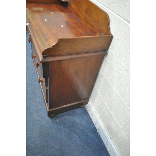 1275 - A VICTORIAN MAHOGANY WASHSTAND, with raised back and sides, fitted with two short over two long draw... 