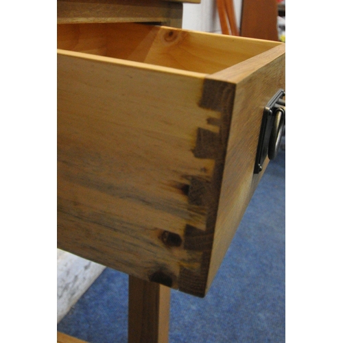 1278 - A MODERN SOLID OAK SIDE TABLE, with two frieze drawers, raised on block legs, united by an undershel... 