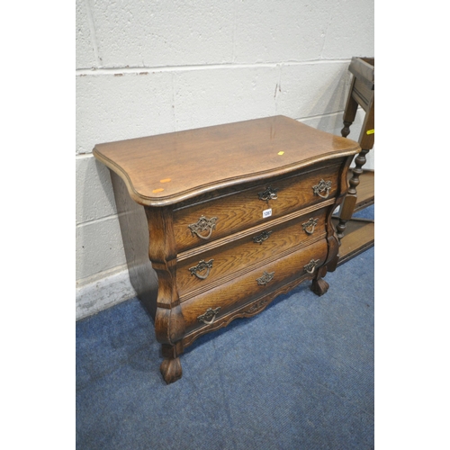 1287 - A 20TH CENTURY OAK BOMBE CHEST OF THREE DRAWERS, raised on ball and claw feet, width 78cm x depth 42... 