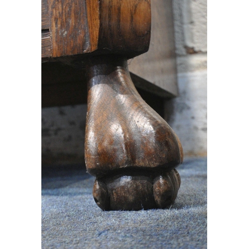 1287 - A 20TH CENTURY OAK BOMBE CHEST OF THREE DRAWERS, raised on ball and claw feet, width 78cm x depth 42... 