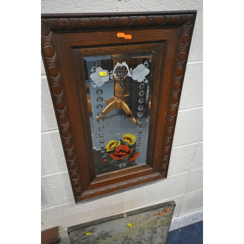 1288 - A NEAR PAIR OF DECORATIVE OAK FRAMED RECTANGULAR BEVELLED EDGE GYPSY WALL MIRRORS, depicting flowers... 