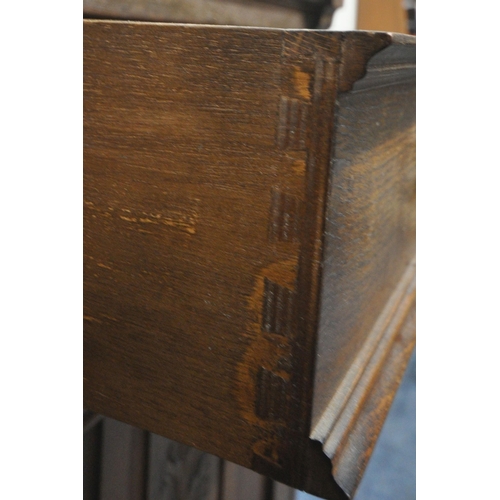 1301 - A 20TH CENTURY OAK SIDEBOARD, fitted with two drawers, above double cupboard doors, length 122cm x d... 