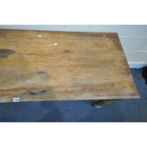 1305 - AN EDWARDIAN MAHOGANY RECTANGULAR TABLE, raised on turned legs and ceramic castors, length 153cm x d... 