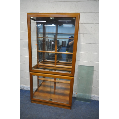 1311 - A MODERN DISPLAY CABINET, with four glass doors, enclosing four glass shelves, width 101cm x depth 4... 