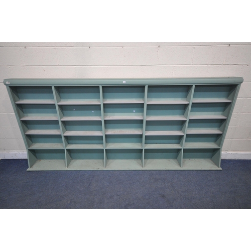 1315 - A LARGE TEAL SHELVING UNIT, with an arrangement of shelving, length 305cm x depth 27cm x height 138c... 