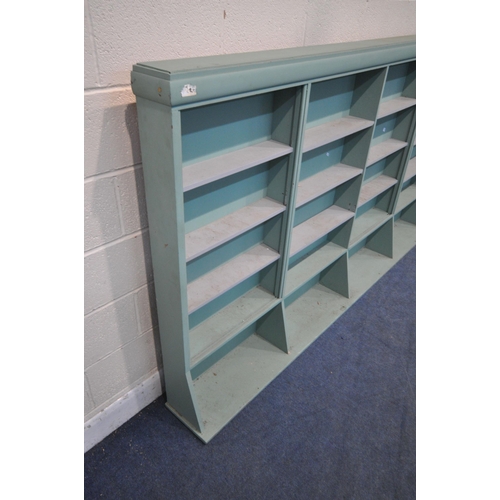 1315 - A LARGE TEAL SHELVING UNIT, with an arrangement of shelving, length 305cm x depth 27cm x height 138c... 