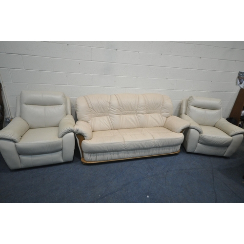 1317 - A CREAM LEATHER THREE SEATER SOFA, length 208cm x depth 99cm x height 96cm, along with a pair of arm... 