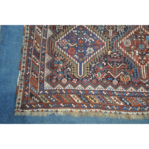 1318 - A LATE 19TH CENTURY QASHKAI HAND WOVEN WOOL RUG, with six medallions, repeating geometric designs, m... 