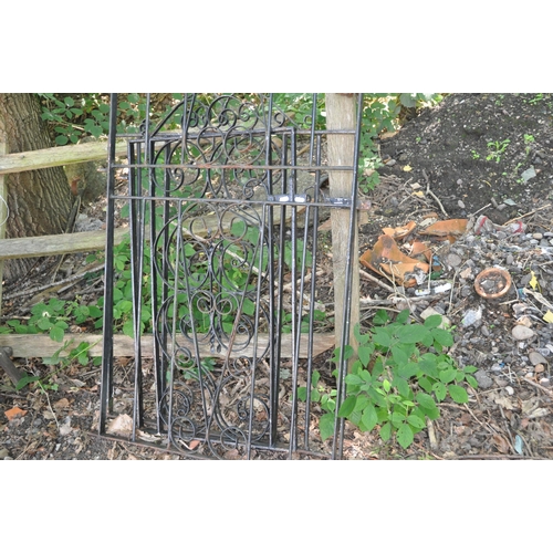 1011 - THREE WROUGHT IRON GATES including one with a domed top width 78cm height 192cm and two shorter gate... 