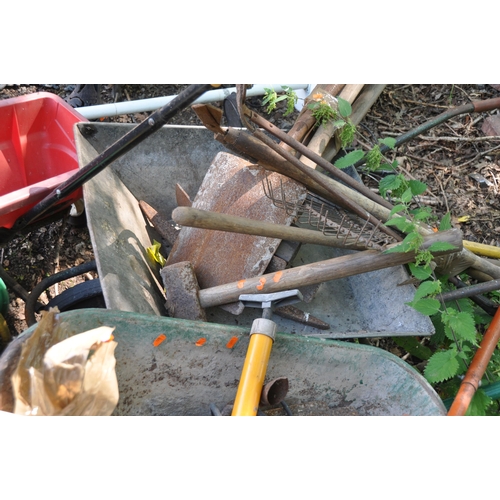 1018 - A SELECTION OF GARDEN TOOLS including two wheel barrows (one tyre flat), two hose reels, shovels, sp... 