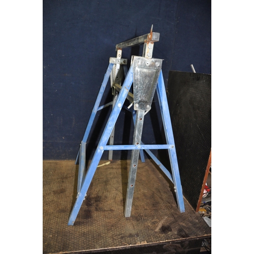 1081 - A PAIR OF VICRORIAN CAST IRON TRESTLE STANDS width 77cm height 73cm, a vintage stirrup pump and a pa... 