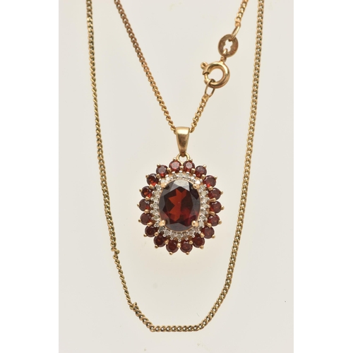 23 - A 9CT GOLD GEM SET NECKLACE, an oval cut garnet prong set with a surround of diamonds and garnets, f... 