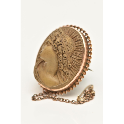 24 - A LAVA CAMEO BROOCH, of oval outline, depicting in high relief a lady in profile, with twist surroun... 