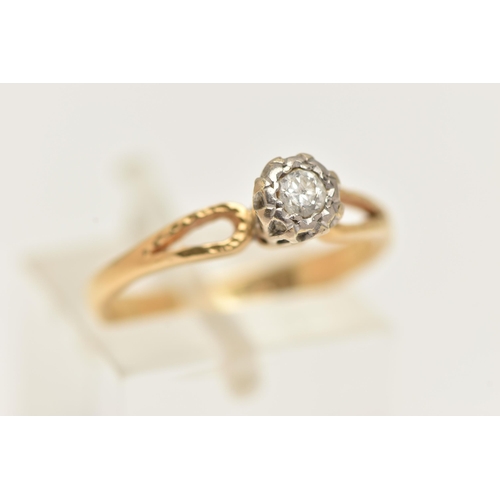 30 - A YELLOW METAL DIAMOND SINGLE STONE RING, the round brilliant cut diamond, illusion set in a white m... 