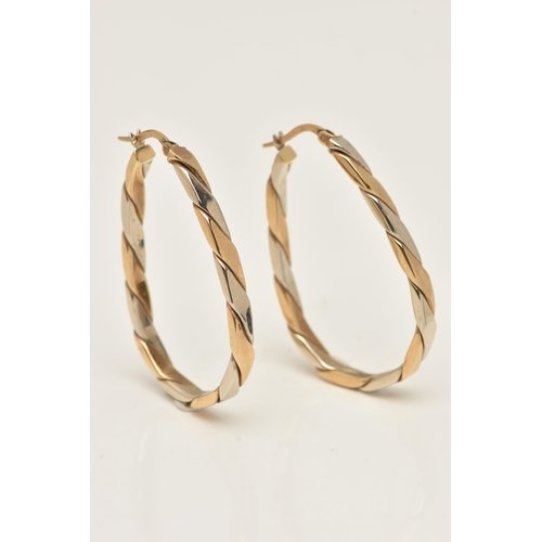 31 - A PAIR OF 9CT BI-COLOUR HOOP EARRINGS, oval hoops with alternating yellow and white gold, lever post... 