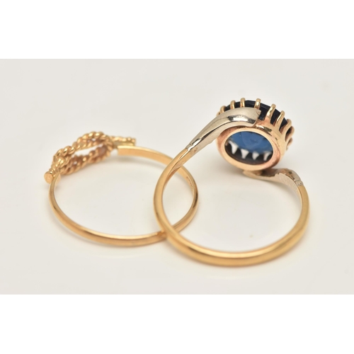 33 - TWO YELLOW METAL RINGS, the first set with a circular cut blue paste, claw setting to cross over sho... 