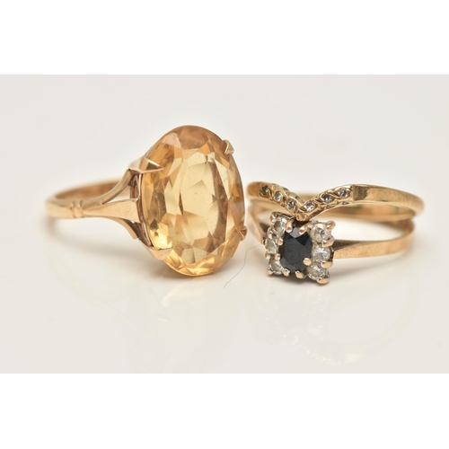 34 - THREE 9CT GOLD RINGS, the first set with an oval cut citrine in a four claw setting, open work galle... 