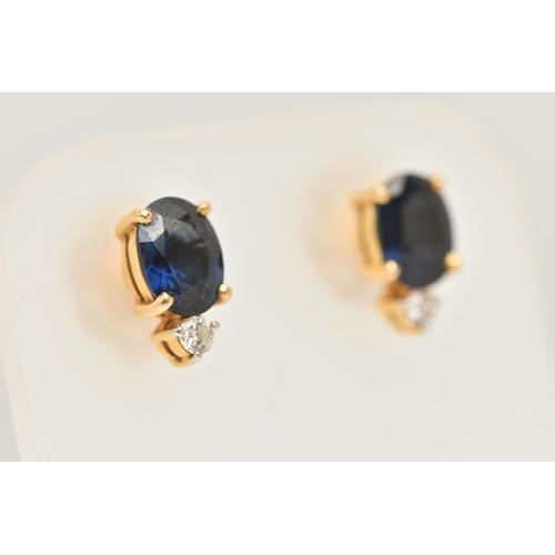 56 - A PAIR OF YELLOW METAL SAPPHIRE AND DIAMOND EARRINGS, each earring set with an oval cut blue sapphir... 