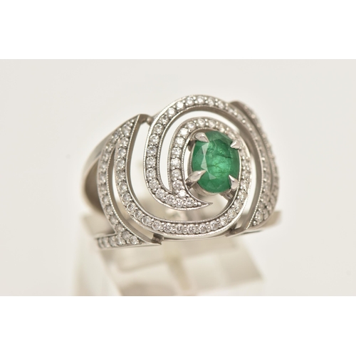 57 - A PLATINUM EMERALD AND DIAMOND DRESS RING, large dress ring set with a central oval cut emerald, in ... 