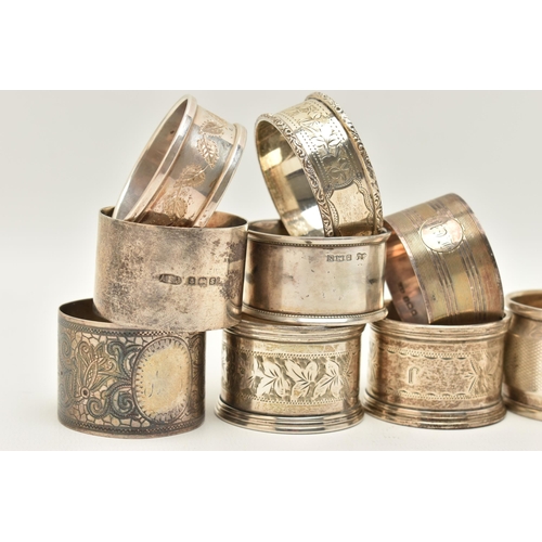 72 - A PARCEL OF SILVER NAPKIN RINGS, four engine turned pattern rings with engraved cartouche, hallmarke... 