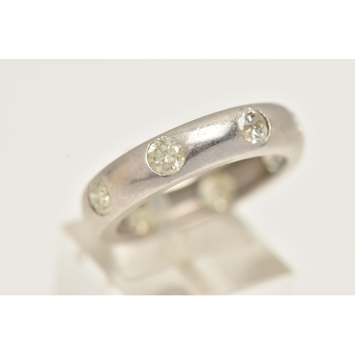 8 - A LARGE PLATINUM ETERNITY BAND RING, a platinum band ring, flush set with eight round brilliant cut ... 