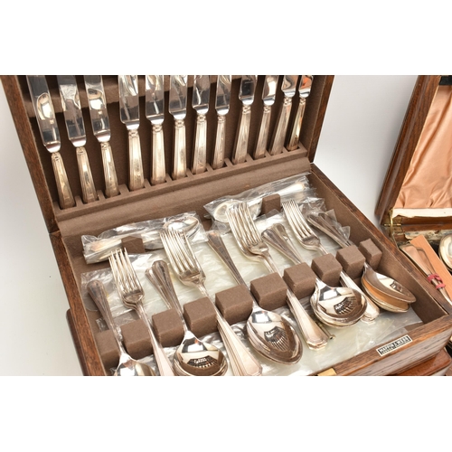 100 - FOUR WOODEN CANTEENS OF CUTLERY, to include an EPNS twelve person table setting of tea knives and fo... 