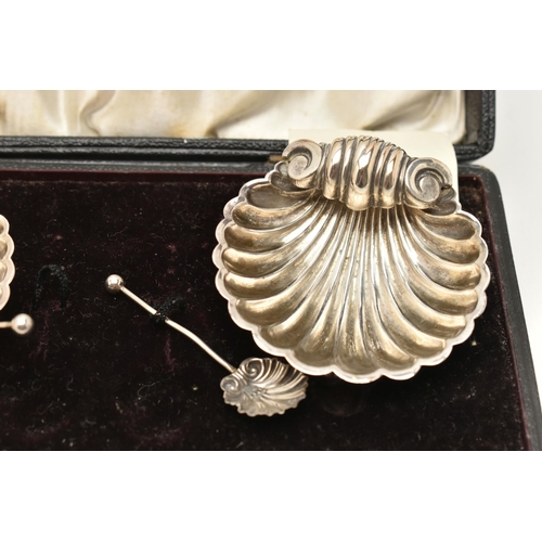 79 - THREE CASED SETS OF SILVER ITEMS, to include a two piece set of shell shape salts with spoons, hallm... 